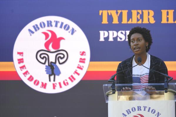 The Mississippi director for Planned Parenthood Southeast, Tyler Harden, tells an audience of reproductive rights supporters that efforts to limit abortion access are "just another form of oppression" for women of color, at a rally in Smith Park Jackson, Miss., on Dec. 1, 2021. (AP Photo/Rogelio V. Solis)