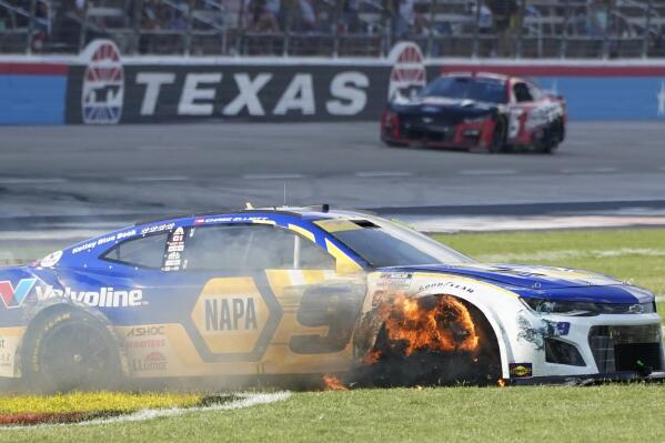 Chase Elliott's tire burns after he contacted the wall during the NASCAR Cup Series auto race at Texas Motor Speedway in Fort Worth, Texas, Sunday, Sept. 25, 2022. (AP Photo/Larry Papke)