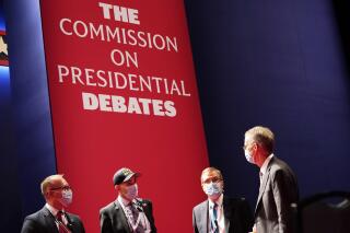 FILE - Officials from the Commission on Presidential Debates gather near the stage before the start of the second and final presidential debate, Oct. 22, 2020, at Belmont University in Nashville, Tenn. The Republican National Committee says it is planning a rules change that would force presidential candidates seeking the party’s nomination to sign a pledge saying they will not participate in any debates sponsored by the Commission on Presidential Debates.  (AP Photo/Patrick Semansky, File)