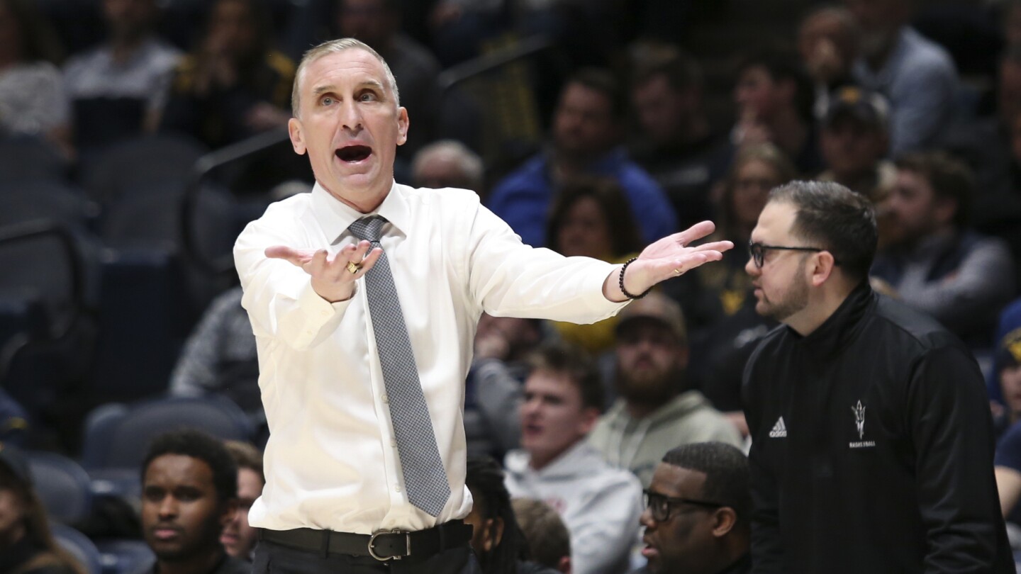 Arizona State coach Bobby Hurley waves players off court after testy finish against rival Arizona