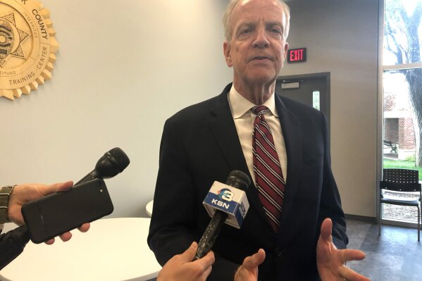 U.S. Sen. Jerry Moran, R-Kan., answers questions from reporters after a round table discussion with law enforcement officials and U.S. Attorney General William Barr at Wichita State University, Wednesday, Oct. 2, 2019, in Wichita, Kansas. Moran says the impeachment inquiry into President Donald Trump is pulling the country apart when it needs to be coming together. (AP Photo/John Hanna)