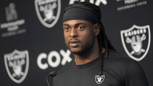 FILE - Las Vegas Raiders wide receiver Davante Adams speaks during a news conference at the NFL football team's training facility Thursday, May 25, 2023, in Henderson, Nev. Prosecutors have dropped a misdemeanor assault charge filed last October against Adams after he shoved a photographer to the ground as he left the field following a loss at Kansas City. The case filed in Kansas City municipal court was dismissed June 5, the Kansas City Star reported. (AP Photo/John Locher, File)