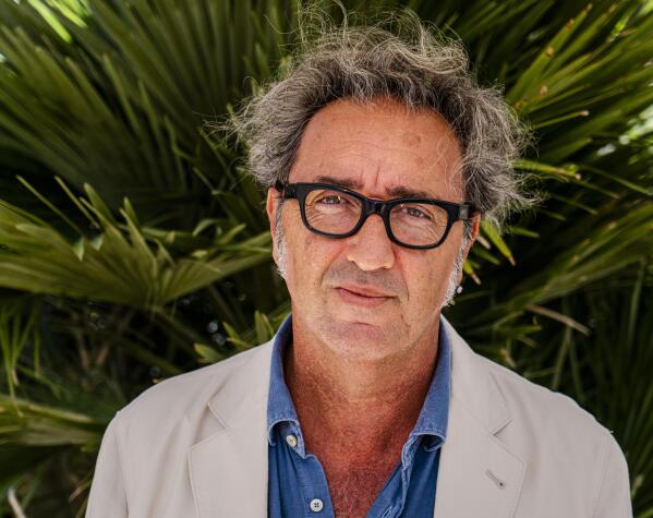 Director Paolo Sorrentino poses for portraits at the 78th edition of the Venice Film Festival at the Venice Lido, Italy, Wednesday, Sept. 1, 2021, where he's presenting his latest movie 'E' stata la mano di Dio' (The hand of God). The festival opens on Sept. 1 through Sept. 11. (AP Photo/Domenico Stinellis)