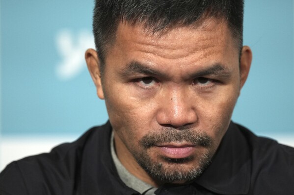 Former Filipino boxer Manny Pacquiao attends a press conference Monday, June 10, 2024, in Tokyo. Pacquiao is scheduled to fight in a three-round match against Japanese mixed martial arts fighter Chihiro Suzuki in Japan in July. (AP Photo/Eugene Hoshiko)