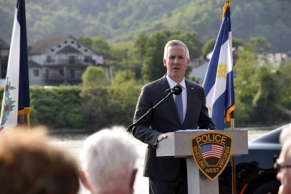 Wheeling Mayor Glenn Elliott speaks during the 10th Annual Wheeling Police Department Law Enforcement Memorial ceremony at Wheeling Heritage Port in Wheeling, W.Va., on May 18, 2023. Outgoing U.S. Sen. Joe Manchin endorsed the on Monday, April, 22, 2024, in the Democratic primary race for his seat representing deep-red West Virginia, where Manchin is currently the only Democrat holding statewide office. (Eric Ayres/The Intelligencer via AP)