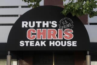 FILE - A Ruth's Chris Steak House sign is shown in San Francisco, Tuesday, April 21, 2020. Darden Restaurants is buying Ruth’s Hospitality Group Inc., the owner of Ruth’s Chris Steak House, for about $715 million, Wednesday, May 3, 2023. Darden will acquire all outstanding shares of Ruth’s for $21.50 per share. (AP Photo/Jeff Chiu, File)