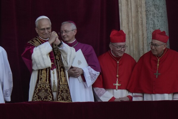 Pope Leo XIV appears on the balcony of St Peter's Basilica after his election, at the Vatican, Thursday, May 8, 2025. (AP Photo/Luca Bruno)