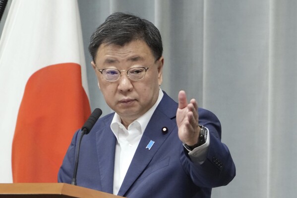 Japan's Chief Cabinet Secretary Hirokazu Matsuno attends a press conference in Tokyo Friday, Sept. 1, 2023. Japan’s government announced Friday it will impose sanctions against three groups and four individuals for supporting North Korea’s missile and nuclear development program. (Kyodo News via AP)