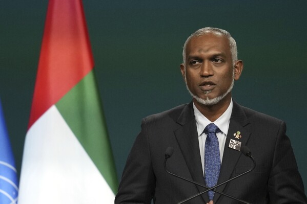 FILE - Maldives President Mohamed Muizzu speaks during a plenary session at the COP28 U.N. Climate Summit, Friday, Dec. 1, 2023, in Dubai, United Arab Emirates. The Maldives government says it has asked for clarification of why the Indian coast guard boarded three Maldivian fishing vessels within its economic zone earlier this week without consultation. (AP Photo/Rafiq Maqbool, File)