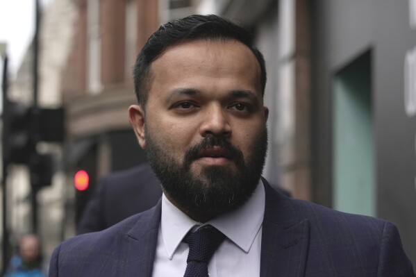 FILE - Former Yorkshire player Azeem Rafiq arrives at the International Arbitration Centre, in London, Thursday, March 2, 2023. Yorkshire has been fined and docked points in two formats of cricket over the club’s “extremely serious” misconduct in relation to the racism experienced by former player Azeem Rafiq. The English club was fined 400,000 pounds ($515,00) on Friday, July 28 with 300,000 pounds of this suspended for two years. (AP Photo/Kin Cheung, file)