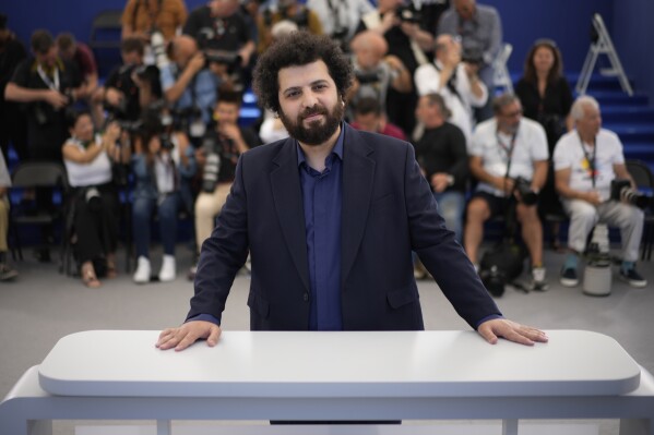 FILE - Director Saeed Roustayi poses for photographers at the photo call for the film "Leila's Brothers" at the 75th international film festival, Cannes, southern France, on May 26, 2022. Roustayi and his producer on "Leila's Brothers" reportedly face prison time and being barred from filmmaking after they showcased a movie at the Cannes Film Festival without Iranian government approval, drawing immediate criticism internationally from leading American director Martin Scorsese and others. (AP Photo/Daniel Cole, File)