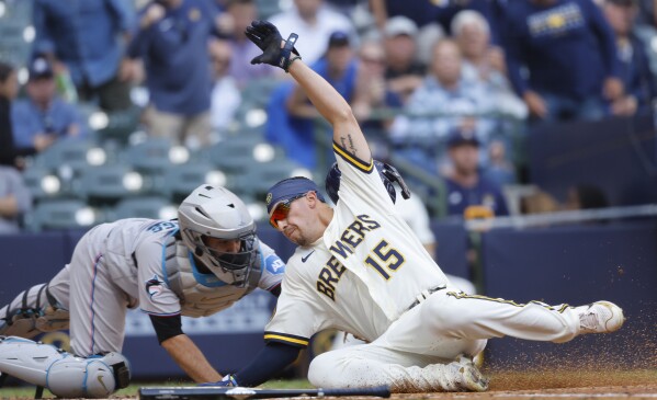 Tyrone Taylor hits 2 RBI doubles and scores go-ahead run in Brewers' 4-2 victory over Marlins | AP News