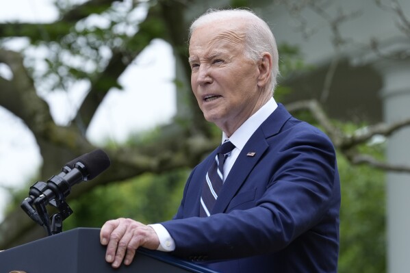 President Joe Biden speaks in the Rose Garden of the White House in Washington, Tuesday, May 14, 2024, announcing plans to impose major new tariffs on electric vehicles, semiconductors, solar equipment and medical supplies imported from China. (AP Photo/Susan Walsh)