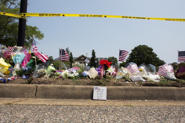 FILE - This June 3, 2019 file photo shows the memorial site honoring victims of a mass shooting that took place on May 31, 2019 at the Virginia Beach Municipal Center in Virginia Beach, Va. A state commission tasked with investigating the 2019 mass shooting in Virginia Beach has called for numerous changes to how Virginia and its communities respond to mass shootings. (L. Todd Spencer/The Virginian-Pilot via AP, File)