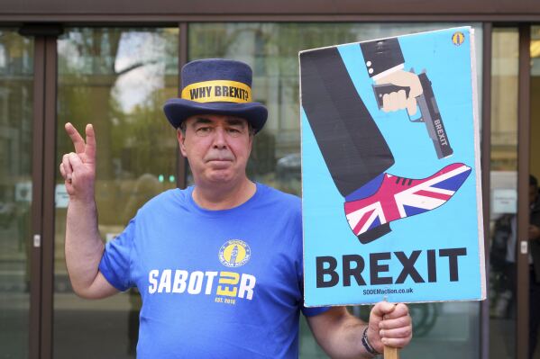 Anti-Brexit campaigner Steve Bray celebrates as he leaves Westminster Magistrates Court in London, Monday, April 14, 2025, after he has been found not guilty to failing without reasonable excuse to comply with a direction given under the Police Reform and Social Responsibility Act 2011. (AP Photo/Kirsty Wigglesworth)