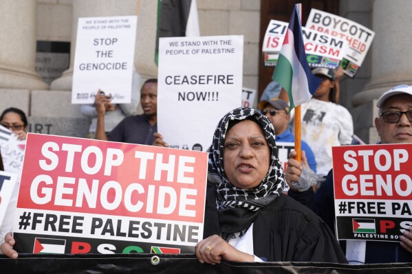 FILE - Pro-Palestinian supporters picket outside the High Court in Cape Town, South Africa, Thursday, Jan. 11, 2024. South Africa’s genocide case against Israel opened last week at the International Court of Justice at The Hague. (AP Photo/Nardus Engelbrecht, File)