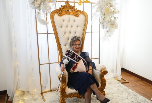 Nelly Meave poses for a photo after being crowned Elderly Spring Queen by the Association of Older Adult in La Paz, Bolivia, Thursday, Sept. 21, 2023. Members of the association, who meet weekly for events, said that Meave, who is known as Nelly the First, was elected this year for her solidarity and friendliness. (AP Photo/Juan Karita)