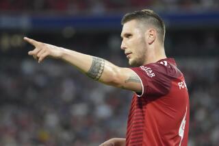 FILE -Bayern's Niklas Suele gestures during the German Bundesliga soccer match between Bayern and Eintracht Frankfurt, in Munich, Germany, Sunday, Oct. 3, 2021. (AP Photo/Matthias Schrader,file)