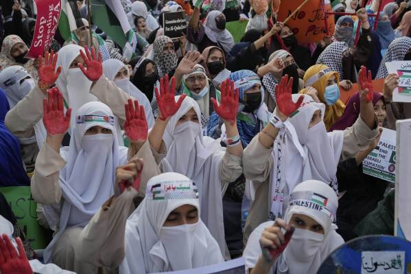 Supporters of the Pakistani religious group "Jamaat-e-Islami" take part in a rally against Israeli airstrikes and to show solidarity with Palestinian people living in Gaza, in Lahore, Pakistan Friday, April 11, 2025. (AP Photo/K.M. Chaudary)