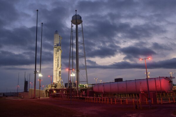 This Tuesday, Oct. 29, 2019 photo made available by NASA shows the Northrop Grumman Antares rocket a few hours after arriving at its launch pad at NASA's Wallops Flight Facility in Virginia. The next delivery of supplies for the International Space Station _ scheduled for liftoff on Saturday, Nov. 1, 2019 _ includes the Zero G Oven. Chocolate chip cookie dough is already up there, waiting to pop into this small electric oven designed for zero gravity. (Bill Ingalls/NASA via AP)