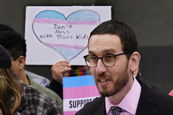 State Sen. Scott Wiener, D-San Francisco, discusses his proposed measure to provide legal refuge to displaced transgender youth and their families during a news conference in Sacramento, Calif., Thursday, March 17, 2022. If approved the measure, that responds to several states, particularly Texas, aims to protect parents from having their transgender children taken away from them or from being criminally prosecuted for supporting their children's access to healthcare, including gender-affirming care. (AP Photo/Rich Pedroncelli)