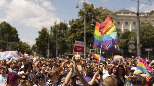 FILE - A view of the annual Gay pride Rainbow Parade, in Vienna, Austria, on June 11, 2022. Austrian authorities said Sunday they had foiled a possible attack on Vienna's Pride parade by three young men who had allegedly sympathized with the extremist Islamic State group. The head of Austria's domestic intelligence service told reporters that the suspects, aged 14, 17 and 20, were arrested before the start of the Saturday's Pride parade, which was attended by around 300,000 people, public broadcaster ORF reported.(AP Photo/Theresa Wey)