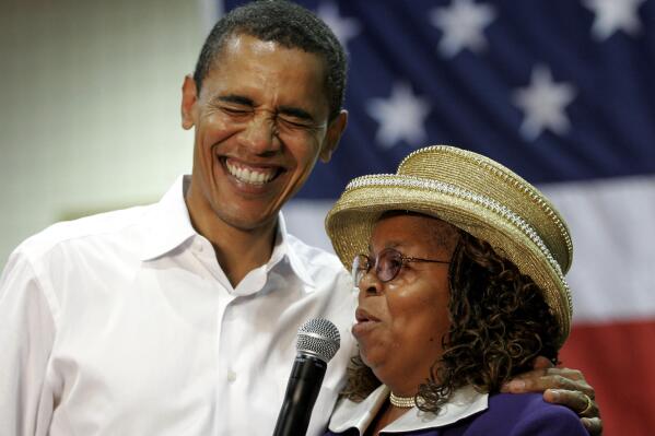 FILE - Presidential hopeful Sen. Barack Obama, D-Ill., left, laughs with Greenwood County, S.C., Council Woman, Edith Childs, right, in Aiken, S.C., on Oct. 6, 2007. Obama is marking the retirement of the South Carolina woman credited with popularizing the chant "Fired up, ready to go!" The chant came to epitomize Obama's two presidential campaigns. The former president says Childs' energy played a key role in lifting his spirits and his candidacy. (AP Photo/Brett Flashnick, File)