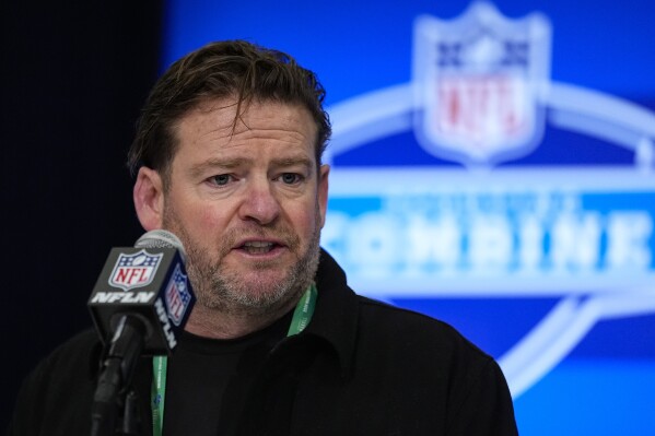 FILE - Seattle Seahawks general manager John Schneider speaks during a press conference at the NFL football scouting combine in Indianapolis, Feb. 27, 2024. For the first time in 14 years, general manager Schneider will be leaning on a new voice inside the Seattle Seahawks draft room. (AP Photo/Michael Conroy, File)