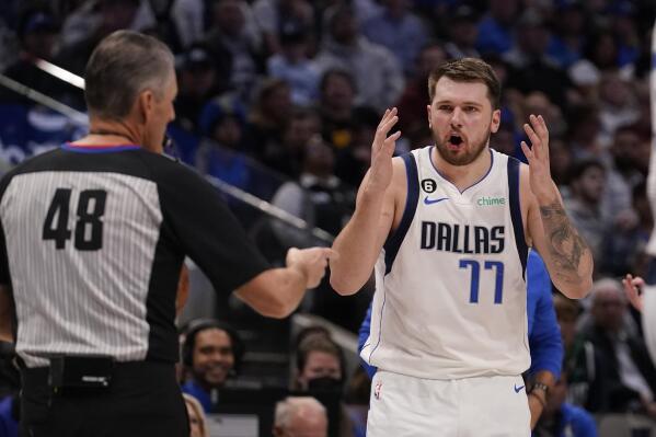 Dallas Mavericks guard Luka Doncic (77) questions a call by referee Scott Foster (48) during the second half of an NBA basketball game against the Atlanta Hawks in Dallas, Wednesday, Jan. 18, 2023. Hawks won 130-122. (AP Photo/LM Otero)