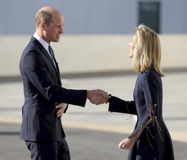 Britain's Prince William shakes hands with Caroline Kennedy outside the John F. Kennedy Library, Friday, Dec. 2, 2022, in Boston. (Matt Stone/The Boston Herald via AP, Pool)