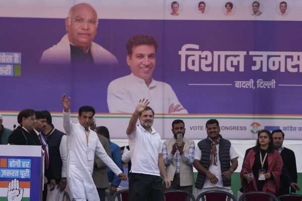 Congress party leader Rahul Gandhi, center, waves to his supporters during Delhi Assembly elections campaign rally in Delhi, India, Thursday, Jan. 30, 2025. (AP Photo/Channi Anand)