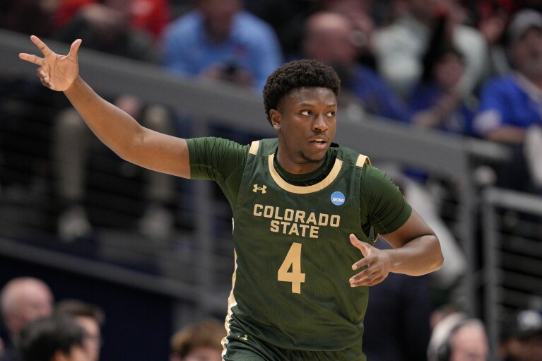 Colorado State's Isaiah Stevens reacts after making a three-point basket during the first half of a First Four college basketball game against Virginia in the NCAA Tournament in Dayton, Ohio, Tuesday, March 19, 2024. (AP Photo/Jeff Dean)