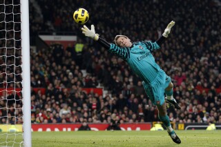 FILE - Arsenal goalkeeper Wojciech Szczesny watches a header from Manchester United's Ji-Sung Park go into the goal during their English Premier League soccer match at Old Trafford, Manchester, England, Monday Dec. 13, 2010. (AP Photo/Jon Super, File)