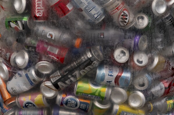 Used beverage containers are seen in a bag outside the Glisan BottleDrop Redemption Center on Thursday, May 15, 2025, in Portland, Ore. (AP Photo/Jenny Kane)