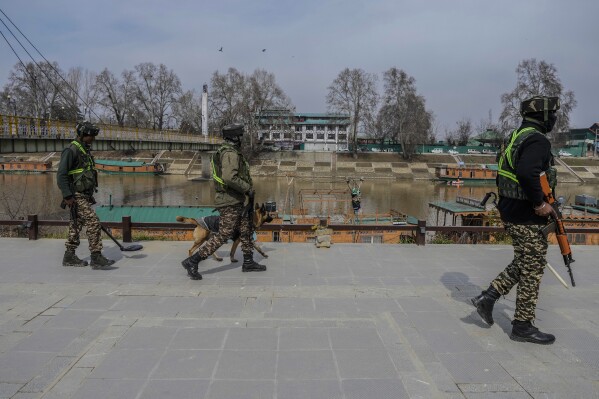 Paramilitary soldiers patrol ahead of Indian Prime Minister Narendra Modi's visit to Srinagar, Indian controlled Kashmir, Wednesday, March 6, 2024. Modi is scheduled to address a public rally in Srinagar on Thursday. (AP Photo/Mukhtar Khan)