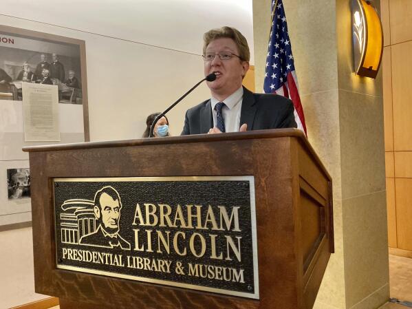 Christian McWhirter, Lincoln historian at the Abraham Lincoln Presidential Library and Museum addresses the importance of the desk that Abraham Lincoln used to draft the presidential inaugural address Thursday, Sept. 16, 2021 in Springfield, Ill.. The desk that Abraham Lincoln used to draft the presidential inaugural address he delivered on March 4, 1861, on the eve of the Civil War, is on display free to the public. Lincoln needed a quiet place away from well-wishers to write the speech, and his brother-in-law, Clark Moulton Smith, offered him a third-floor storage room in the store he owned on the state Capitol square in downtown Springfield. The state purchased the desk from the Smith family in 1953 and this summer spent $6,300 to have it historically restored and repaired. (AP Photo/John O'Connor)