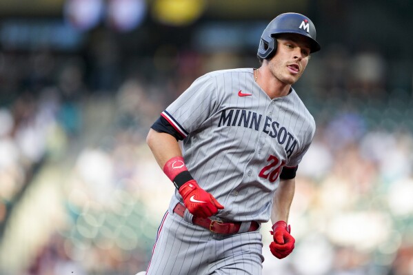 Minnesota Twins' Max Kepler runs the bases after hitting a solo home run against the Seattle Mariners during the fifth inning of a baseball game Wednesday, July 19, 2023, in Seattle. (AP Photo/Lindsey Wasson)
