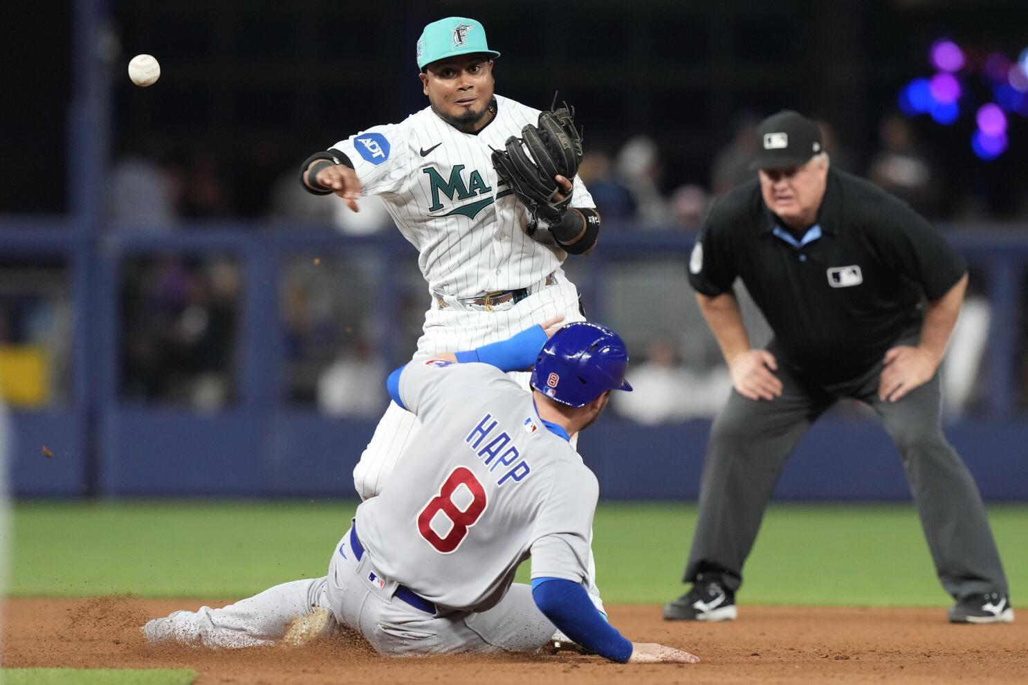 Miami Marlins' Jean Segura (9) hits a single to score the winning run  during the ninth inning of a baseball game against the Chicago Cubs,  Friday, April 28, 2023, in Miami. The