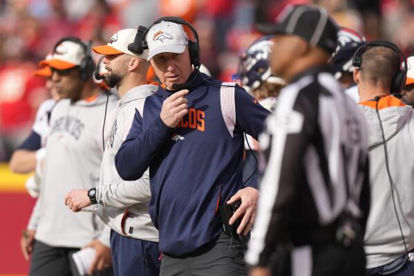 Denver Broncos interim head coach Jerry Rosburg watches from the sidelines during the first half of an NFL football game against the Kansas City Chiefs Sunday, Jan. 1, 2023, in Kansas City, Mo. (AP Photo/Charlie Riedel)