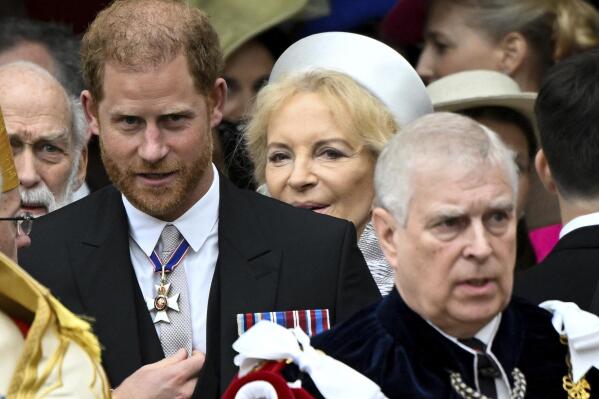 Britain's Prince Harry, Duke of Sussex, and Prince Andrew leave Westminster Abbey following the coronation ceremony of Britain's King Charles and Queen Camilla, in London, Saturday, May 6, 2023. (Toby Melville, Pool via AP)
