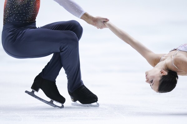 Lucrezia Beccari and Matteo Guarise of Italy perform in the pairs short program during the ISU Grand Prix of Figure Skating - NHK Trophy in Kadoma, near Osaka, Japan, Friday, Nov. 24, 2023. (AP Photo/Tomohiro Ohsumi)