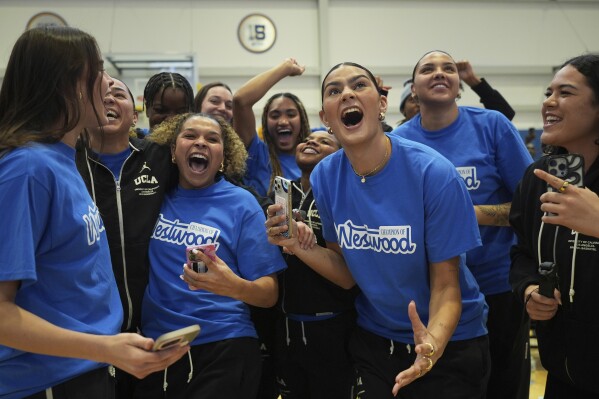 UCLA players react after being revealed as the No. 1 overall seed in the women's NCAA college basketball tournament at the Selection Sunday watch party in Los Angeles, Sunday, March 16, 2025. (AP Photo/Jae C. Hong)
