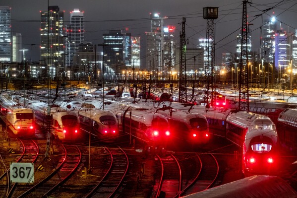 File - Trains are parked outside the central station in Frankfurt, Germany on Jan. 24, 2024 during a planned six-day strike. The International Monetary Fund downgraded the outlook for some countries as Europe continues to struggle with dispirited consumers and the lingering effects of the energy price shock caused by the Russian invasion of Ukraine. (AP Photo/Michael Probst, File)