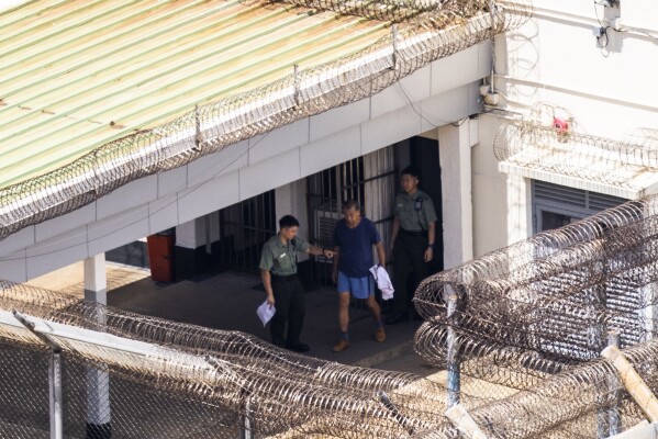 Jimmy Lai exits his building to go for exercise at the Stanley prison in Hong Kong, Friday, Aug. 4, 2023. (AP Photo/Louise Delmotte)