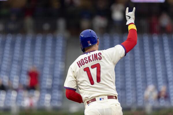 Philadelphia Phillies' Rhys Hoskins gestures after hitting a three-run home run during the fifth inning of a baseball game against the Washington Nationals, Sunday, Sept. 11, 2022, in Philadelphia. (AP Photo/Laurence Kesterson)
