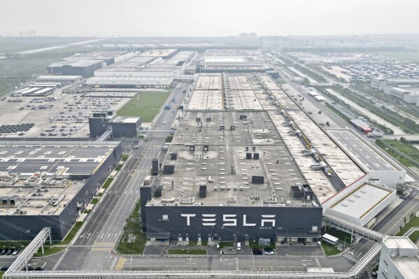 In this a photo released by Xinhua News Agency, the Tesla Gigafactory in Lingang new area of the China (Shanghai) Pilot Free Trade Zone is seen in east China's Shanghai on Sept. 26, 2023. American electric automaker Tesla's plans to produce energy-storage batteries in China moved forward on Friday, Dec. 22, 2023, with a signing ceremony for the land acquisition in Shanghai, China's state media said. (Liu Ying/Xinhua via AP, File)