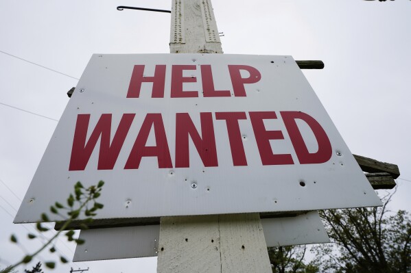 A help wanted sign is posted in Lansdale, Pa., Friday, April 28, 2023. (AP Photo/Matt Rourke, File)