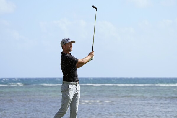 Webb Simpson hits from the 17th tee during the first round of the Sony Open golf event, Thursday, Jan. 11, 2024, at Waialae Country Club in Honolulu. (AP Photo/Matt York)