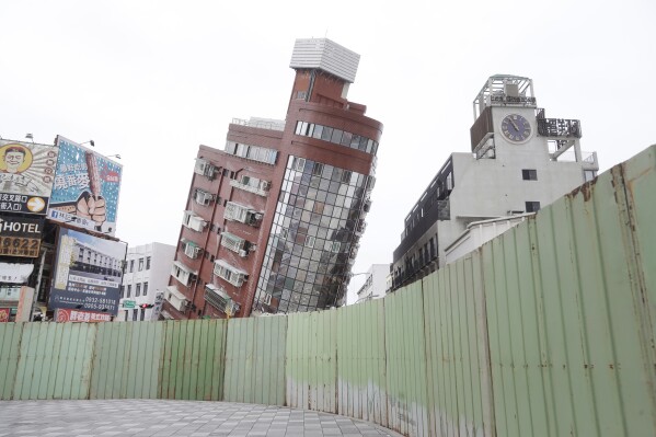 A building is seen partially collapsed, two days after a powerful earthquake struck the city, in Hualien City, eastern Taiwan, Friday, April 5, 2024. (AP Photo/Chiang Ying-ying)