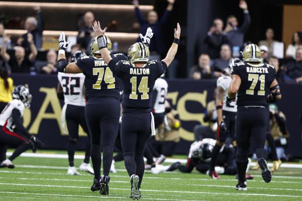 New Orleans Saints quarterback Andy Dalton (14) reacts after a touchdown by tight end Juwan Johnson (83) In the first half of an NFL football game against the Atlanta Falcons in New Orleans, Sunday, Dec. 18, 2022. (AP Photo/Butch Dill)